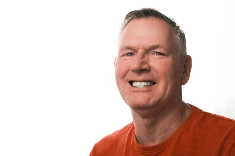 Patient smiling confidently after All-on-6 implant treatment at a dental clinic in Turkey